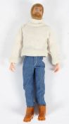 A vintage Action Man with blond hair and beard, in a roll neck sweater,