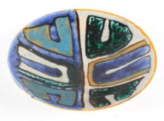 A Poole Pottery Charger, with abstract designs in greens and blues on a grey ground, printed marks,