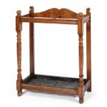 A Victorian oak umbrella/stick stand, with turned baluster uprights,