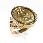 A yellow metal ring set with a full sovereign dated 1958. Hallmarked 9ct gold, London, 1970.