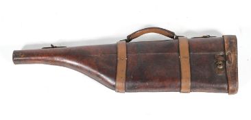 A vintage leather gun case, with copper and brass lock and strap handle and loops,