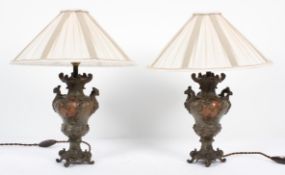 A pair of late 19th century spelter vases adapted as lamps,