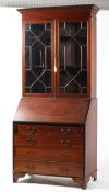 A Georgian style mahogany and inlaid bureau bookcase,