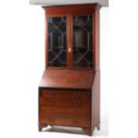 A Georgian style mahogany and inlaid bureau bookcase,