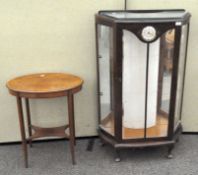 A 20th century mahogany display cabinet with clock to front,