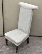 A Victorian high back chair, upholstered in a duck egg blue floral fabric,