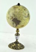 A small terrestrial globe on a brass mount,