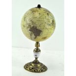 A small terrestrial globe on a brass mount,