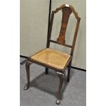 A 19th century chair with bergere seat, cabriole supports,