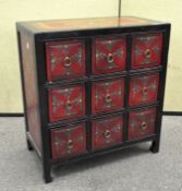 A Contemporary Asian collector's cabinet, comprising nine drawers,