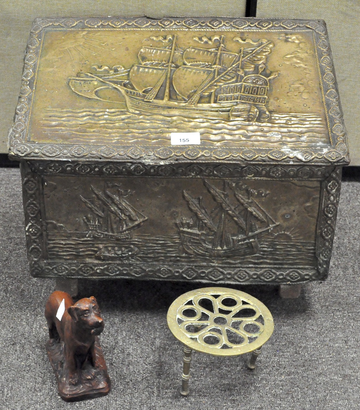 An early 20th century hammered brass coal box, the other depicting masted ships at sea,