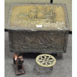 An early 20th century hammered brass coal box, the other depicting masted ships at sea,