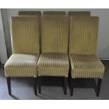 Six modern dining chairs, upholstered in gold fabric, with wooden legs,