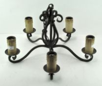 A 5 light wrought iron chandelier 55cm diameter