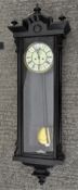A late 19th/early 20th century ebonised Vienna style wall clock,