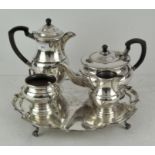 A Garrard & Co silver plated four piece tea service and tray with inscription,