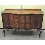 A Regency style mahogany veneered serpentine sideboard