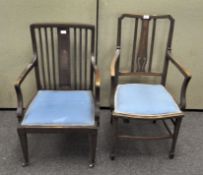 Two wooden chairs with inlaid details to the framework and blue upholstery,