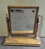 A pine dressing table mirror on a rectangular stand,