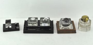 A Velos double inkwell on black ceramic base,