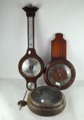 Two contemporary clocks, battery powered, both cased in wood with circular dials and Roman numerals,