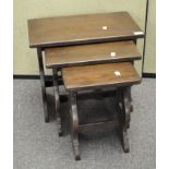 A nest of three oak tables