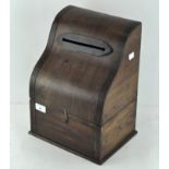 A wooden tabletop post box,