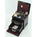 A leather cased jewellery box, containing a selection of necklaces,