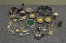 A large quantity of brassware, including a set of three engraved bowls, animal figures,