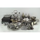 A collection of silver plated wares including cruets, muffin dishes, cutlery,