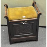 A mahogany hall seat with upholstered seat, drop front opening to reveal a magazine rack,