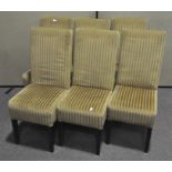 Six modern dining chairs, upholstered in gold fabric, with wooden legs,