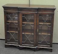 A Regency style mahogany breakfront display cabinet with astragal glazing,