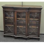 A Regency style mahogany breakfront display cabinet with astragal glazing,