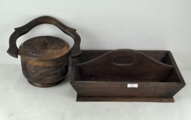 A wooden cutlery tray and an Eastern wooden food pot and cover,