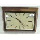 A vintage Metamec wall clock, of rectangular form, the dial with batons denoting hours,