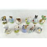 Eleven Beatrix Potter figures, including Benjamin Bunny, Jemima Puddleduck,