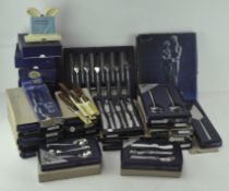 A collection of mostly stainless steel flatware, including numerous boxed Viners Love Story pieces,