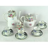 A set of four Royal Doulton cups and saucers decorated with landscape scenes,