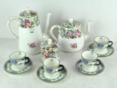 A set of four Royal Doulton cups and saucers decorated with landscape scenes,