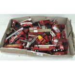 A collection of plastic and die cast fire engines and similar vehicles