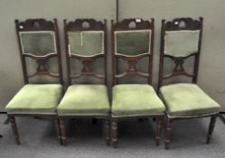 A set of four late Victorian dining chairs,