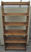A 20th century pine bookcase with graduated shelves,