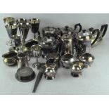 A large collection of silver plated wares, including teapots, coffee pots, goblets, jugs,