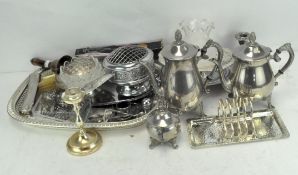 An extensive collection of silver plated wares, including toast racks and napkin rings,