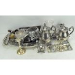 An extensive collection of silver plated wares, including toast racks and napkin rings,