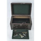 A Chinese camphor wood jewellery/work box with engraved decoration throughout the exterior,