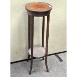 A late 19th century mahogany jardiniere stand of circular form, raised on splayed legs,