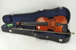 A modern violin in case, label to inside reads ref no MV 005,