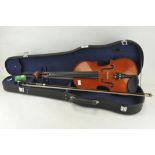 A modern violin in case, label to inside reads ref no MV 005,